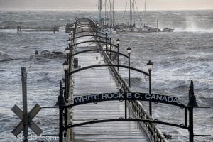 The dock with boats attached smashes through the pier